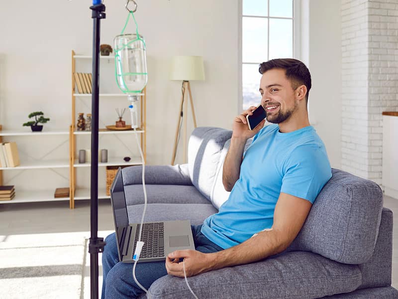 man receiving iv therapy nad
